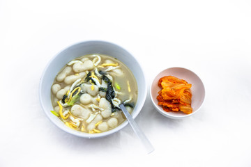 Korean style rice cake soup which is called Jolaeng-i Ddukkuk eats on the Lunar moon new year