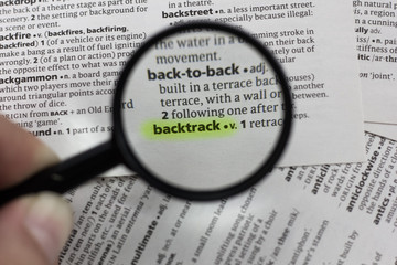 The word or phrase backtrack in a dictionary.