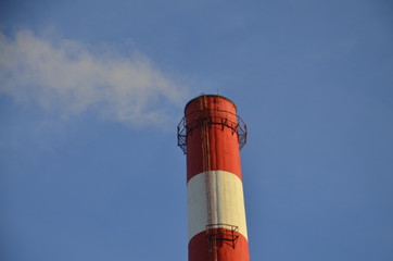 The pipe of the thermal power plant from which smoke comes