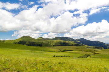 View over lush green meadows and soft green mountains, Drakensberg, Giants Castle Game Reserve, South Africa