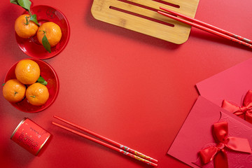 red background flatlay with chinese lunar new year elements