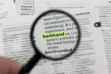 Obraz premium The word or phrase backhand in a dictionary.