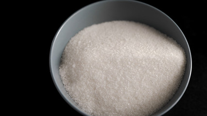 Ingredients and products in the kitchen. Sugar sand in a dish. The chef has prepared the ingredients for the future of the culinary product.
