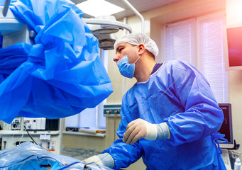 Modern equipment in operating room. Team surgeon at work in operating room.