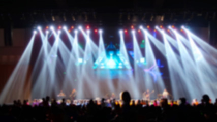 blurred picture of concert in hall at night 