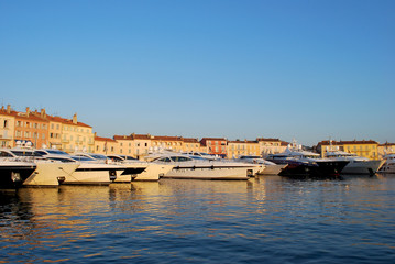 Fototapeta premium Yachts parked in the famous Saint-Tropez harbour on a nice summer evening