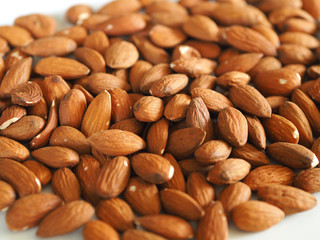 almond nuts on a white background. healthy foods