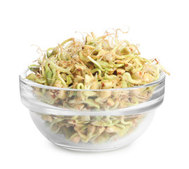 Glass bowl of sprouted green buckwheat isolated on white
