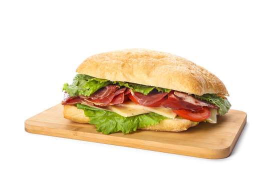 Delicious sandwich with fresh vegetables and prosciutto isolated on white