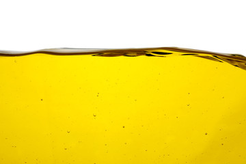 Cooking oil flow isolated on white. Color liquid