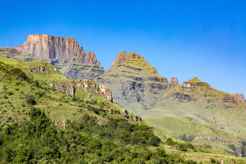 Monk's Cowl, Champagne Castle and Cathkin Peak on a sunny summer day and blue sky, Drakensberg, South Africa