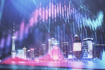 Financial graph on night city scape with tall buildings background double exposure. Analysis concept.