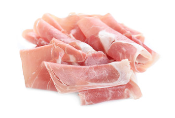 Slices of tasty prosciutto on white background