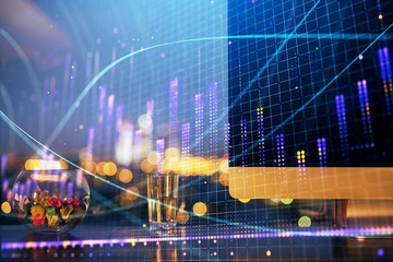 Financial graph colorful drawing and table with computer on background. Double exposure. Concept of international markets.