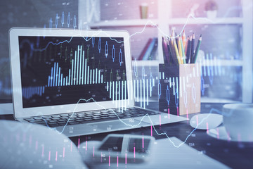 Stock market graph and table with computer background. Multi exposure. Concept of financial analysis.