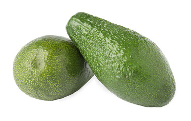 Tasty ripe avocados on white background. Tropical fruit