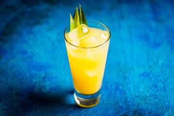 Pineapple cocktail in highball glass. Selective focus. Shallow depth of field.
