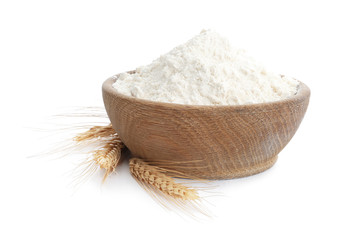 Organic flour and spikelets isolated on white