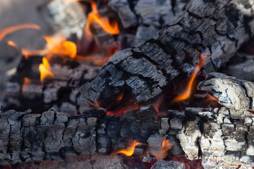 Glowing Hot Charcoal In BBQ Grill Pit With Flames Background Texture, Close-up