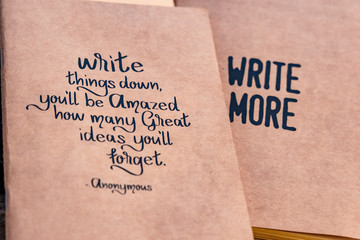 Notebooks with great quotes placed next to each other. selective focus