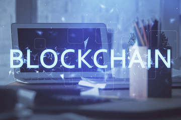 Double exposure of blockchain theme hologram and table with computer background. Concept of bitcoin...