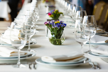 Festive table decor with spring flowers, Table set for event party or wedding reception, ceremony, celebration