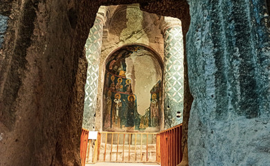 Gumusler Monastery from inside. Sacred Frescos on the wall of the Cave Church in Cappadocia