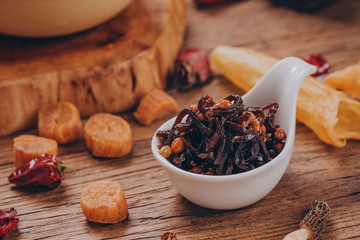 A long, spoon-like, white cutlery contained a fillet of shredded beef with peanuts in it, and the...