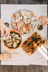 Top view of steamed Flower Crabs and Giant Mud Crabs with separated parts of steamed crab such as...
