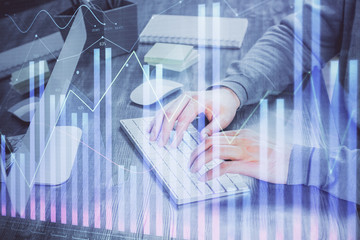 Double exposure of financial graph with man works in office on background. Concept of analysis.