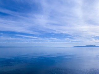 Blue sea, sky reflection on the sea water