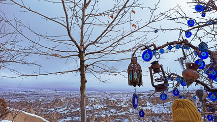 Blue Evil eye charms hang on the tree in Cappadocia, Turkey