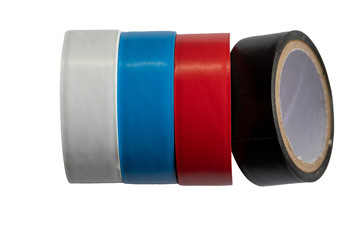 White, blue, red and black insulation tape on a white background. Close up. Selective focus
