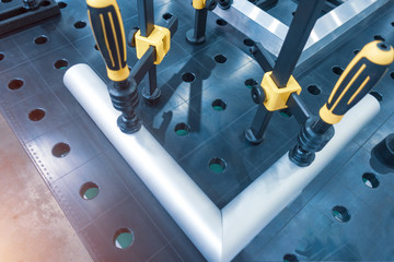 Metal welding table with mounting brackets