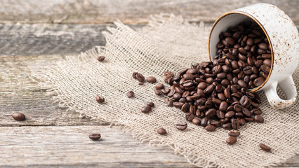 Copyspace with full coffee cup of coffee beans.