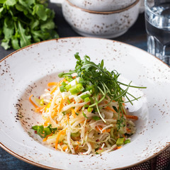 Tasty cabbage salad with carrots and onion. Diet and healthy food. Closeup