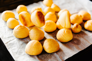Cooking dessert. A tray with fresh eclair bakery products puff pastry with falling eclarir