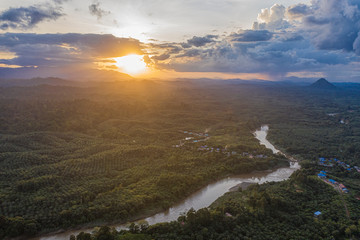 Aerial view misty and foggy morning at the Imbak Village in Tongod, Sabah, Malaysia, Borneo. Certain part with rainforest jungle and palm oil plantation.