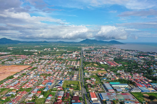 Aerial view of the wild river with the old wooden bridge connecting between two mainland in Kampung Imbak, Tongod, Sabah, Malaysia, Borneo.