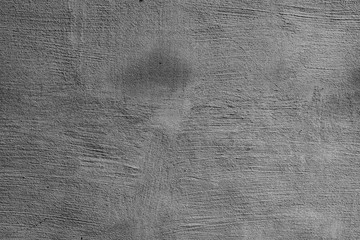 Texture of a concrete wall with cracks and scratches which can be used as a background