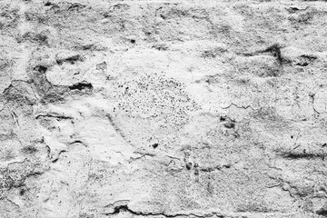 Texture of a brick wall with cracks and scratches which can be used as a background