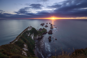 Beautiful sunrise at Nugget Point Lighthouse, New Zealand
