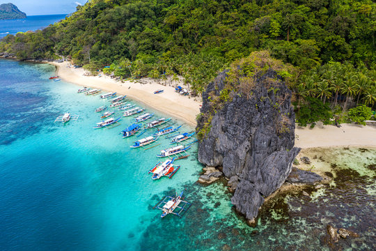 Top view of beautiful turquoise beach, with white sand. Best beaches of Philippines. Seven Commandos beach, Palawan
