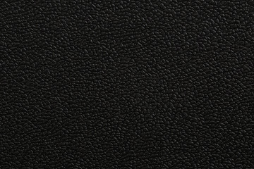 Black bumpy surface of plastic plate. Texture of plastic.