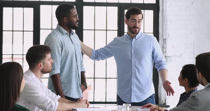 Best african male employee get rewarded at team meeting