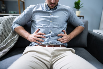 Man In Pain Holding His Stomach