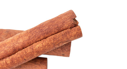 Cinnamon sticks isolated on white background, close-up, top view