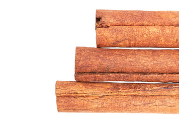 Cinnamon sticks isolated on white background, close-up, top view