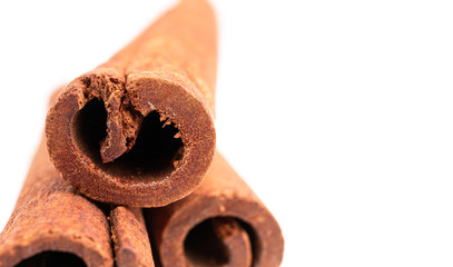 Cinnamon sticks isolated on white background, close-up view