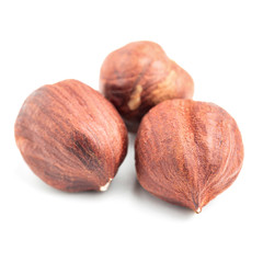 Hazelnuts isolated on white background, close-up view